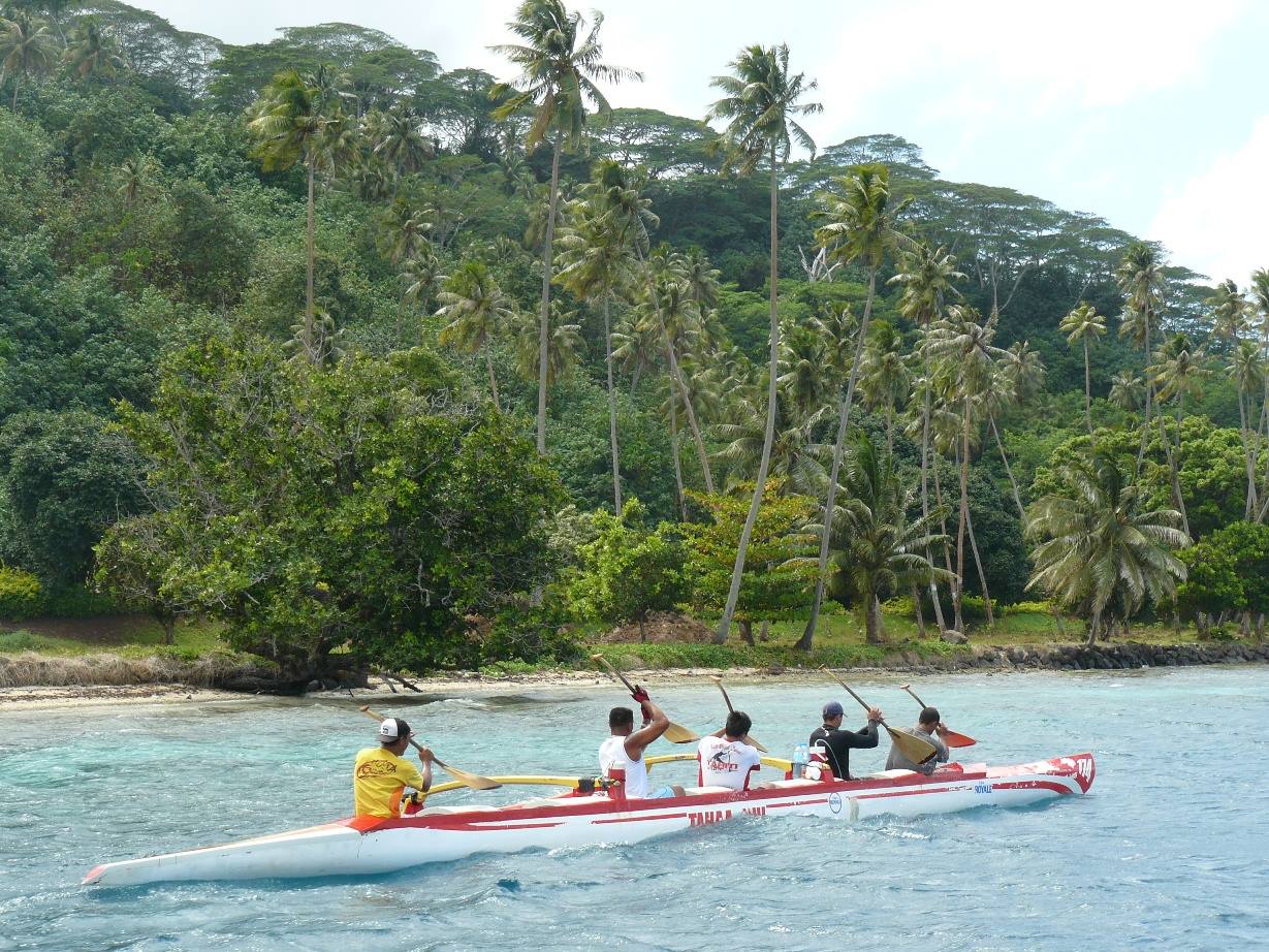 Outrigger canoe along the coast of Tahaa