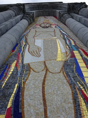 Human figure mosaic on Hallgrímskirkja facade in Reykjavík