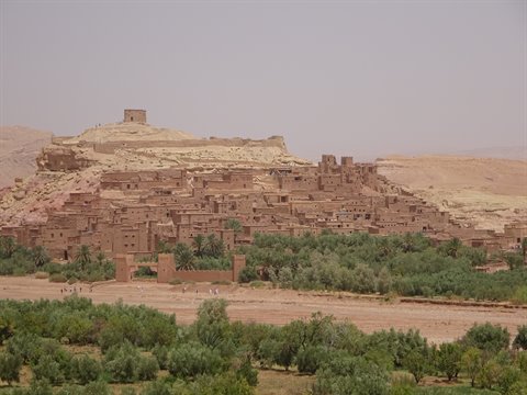 Ait Ben Haddou earthen ksar rising above the olive groves