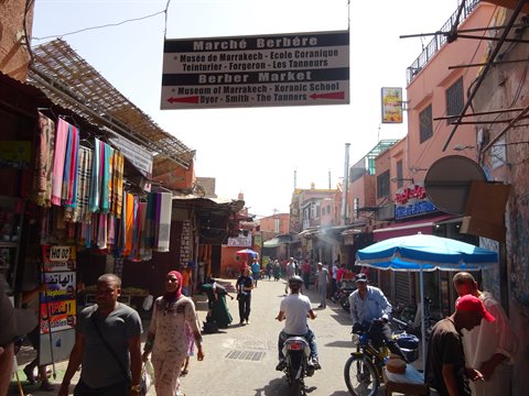 Marché Berbère sign above the busy dyers' street in Marrakech
