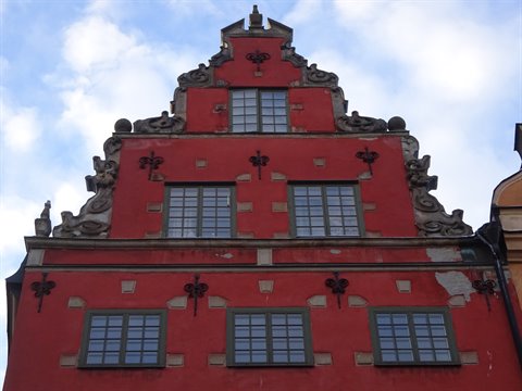 Red Baroque gabled facade at Stortorget square, Stockholm