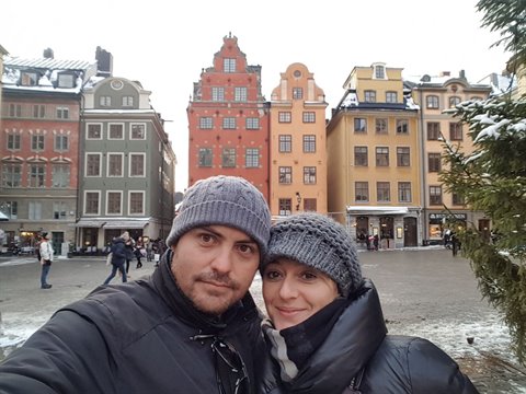 Couple selfie at Stortorget, Gamla Stan, colorful facades in winter