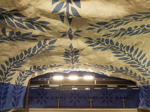 Blue leaf patterns painted on rock ceiling at T-Centralen station, Stockholm