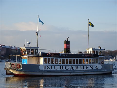 Ferry Djurgården 4 with Swedish flag sailing in Stockholm
