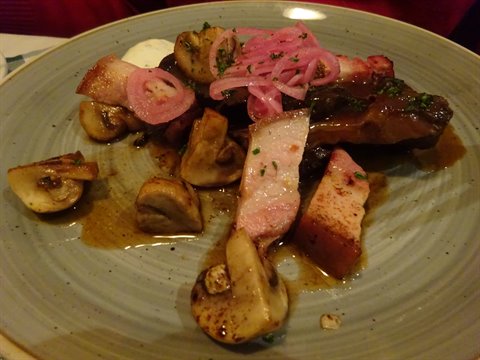 Dish of mushrooms, pork belly and pickled red onion, Stockholm
