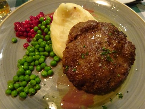 Swedish meatballs with peas, mashed potatoes and lingonberries on a Stockholm plate