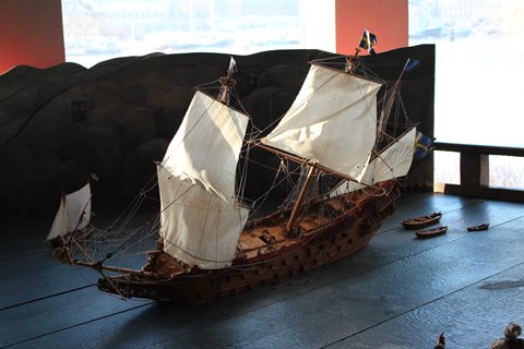 Wooden model of the Vasa ship at the Vasa Museum, lit white sails