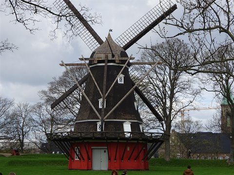 Wooden windmill with red base in Kastellet park, Copenhagen