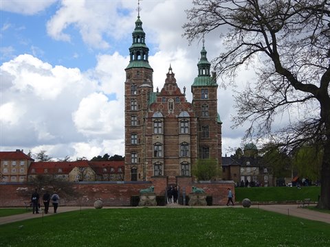 Rosenborg Castle in Copenhagen, brick facade seen across the lawn