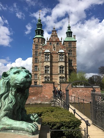 Green lion statue in front of Rosenborg Castle in Copenhagen