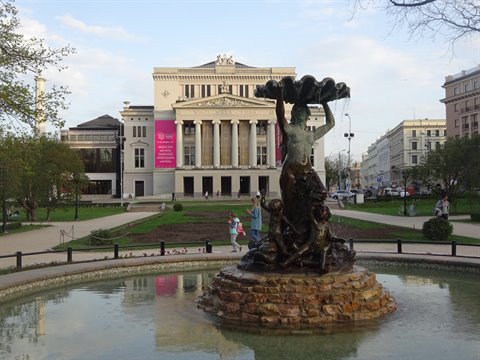 Bronze fountain in front of Riga's National Opera, afternoon light