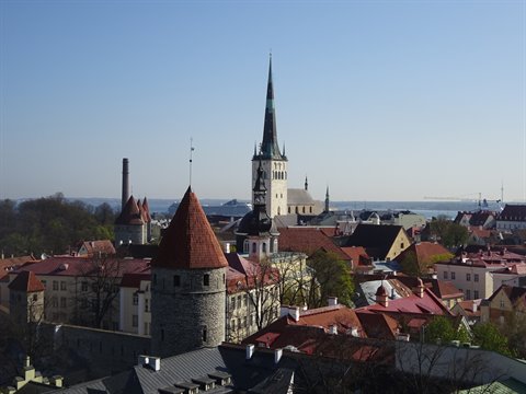 Medieval stone towers, red rooftops and church spire, Tallinn