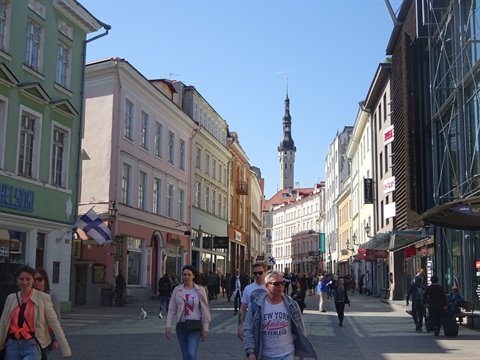 Pedestrians on Viru Street, Tallinn, with the Gothic town hall spire behind