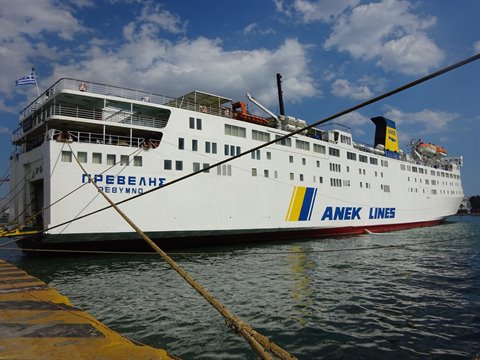 White Anek Lines ferry Preveli moored at the harbor under cloudy sky