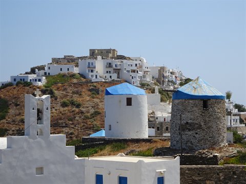 White windmills at Artemonas, Sifnos, hillside houses under the sun