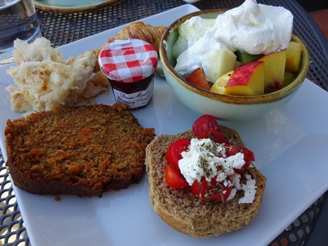 Breakfast with carrot cake, dakos with feta and fruit in Sifnos