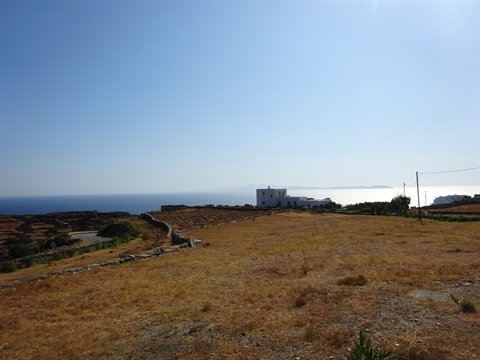 Dry fields and white house facing the Aegean sea in Sifnos
