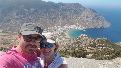 Couple selfie above Kamares bay, Sifnos, white houses and turquoise sea