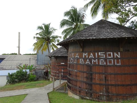 La Maison du Bambou: giant wooden barrel building, palm trees