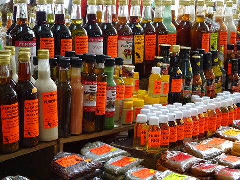 Rum bottles and spices at Fort-de-France market, Martinique