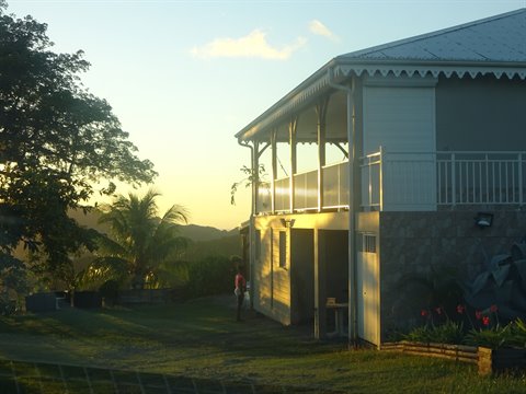 Creole wooden house with porch in golden morning light