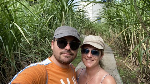 Couple selfie on a path through sugarcane fields in La Trinité