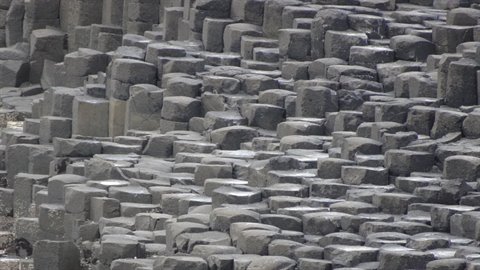 Hexagonal basalt rock columns under diffuse light,geological journal page