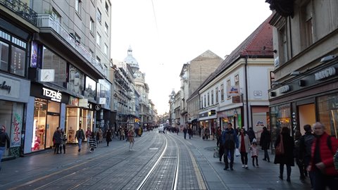 Pedestrians walking along tram tracks on Ilica street, Zagreb