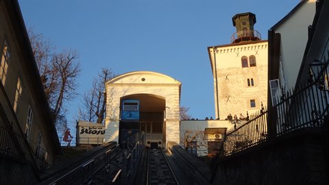 Zagreb funicular climbing toward the white gate beside the Lotrščak tower