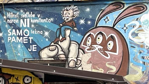 Graffiti mural of Fibonacci on a giant finger with a red bunny, Metelkova