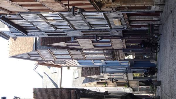 Medieval half-timbered wooden houses along a cobblestone street in Rouen