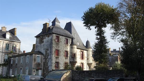 An old manor steeped in history, under a sky that promises wonders.