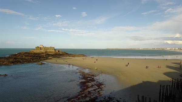 Fort National on rocky reef at low tide, Saint-Malo sandy beach