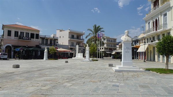 Sunny squares, flags in the wind: Greece welcomes us with open arms.