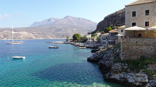 The sea cradled the boats while time stood still here.