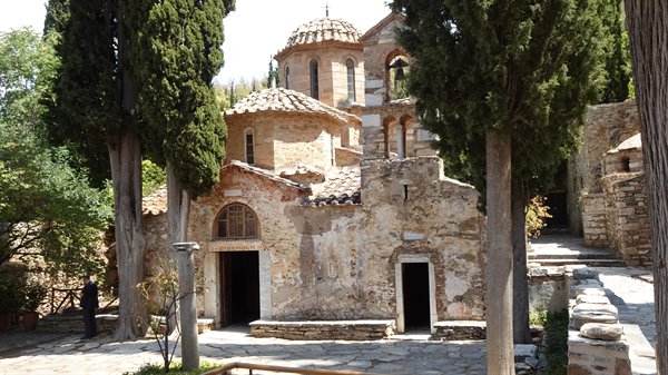An ancient monastery among the cypresses, here time breathes slowly.