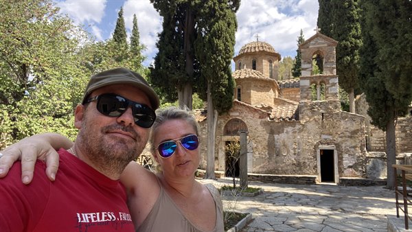 Smiling in the sun in front of an ancient church: moments that stay.