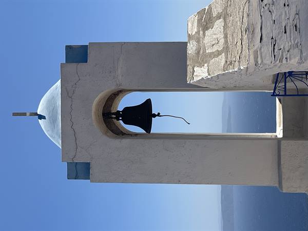 The silent bell guards the blue sea of those islands.