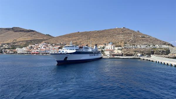 The ferry waits for us, the island waves goodbye under the sun.