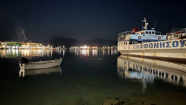 The harbour sleeps under the lights, and we already dream of departure.
