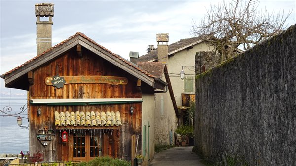 Yvoire, wooden and stone houses by Lake Geneva, soft light