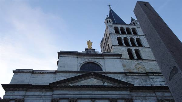 Notre-Dame-de-Liesse church in Annecy, stone facade with golden Virgin statue