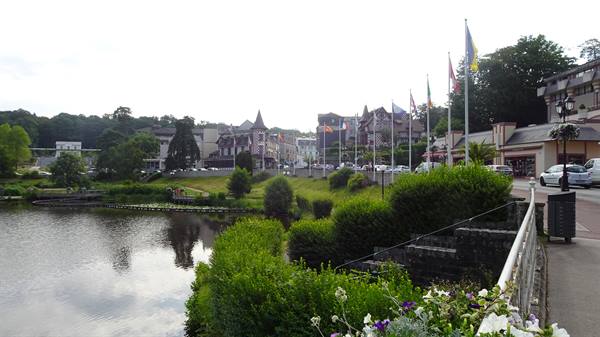 Lakeside half-timbered houses and flags in Bagnoles de l'Orne town center