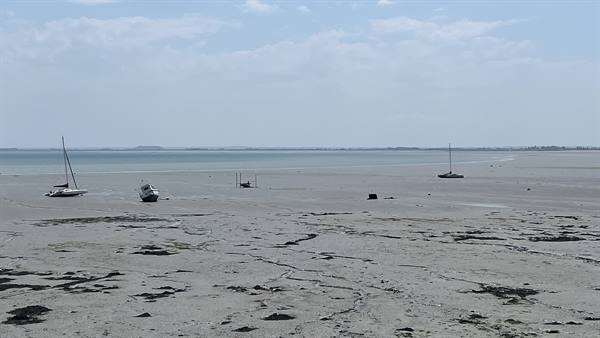 Boats stranded on the sand at low tide, Gouville sur Mer