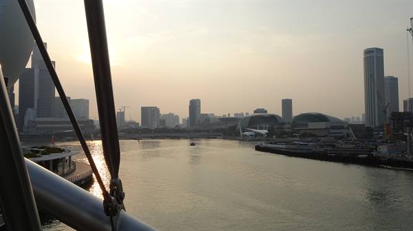 Marina Bay, Singapore, morning haze over skyscrapers and ArtScience Museum from the Flyer