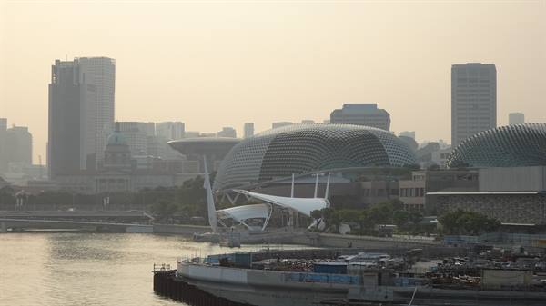 Esplanade Theatres on Singapore bay among skyscrapers in the haze