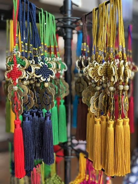 Colours and luck hanging at the market: I chose my lucky charm.
