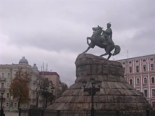 Bronze equestrian statue on granite base, Sofiiska Square in Kyiv, gray sky