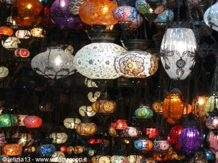 Colorful Moroccan lanterns in glass and metal hanging lit up
