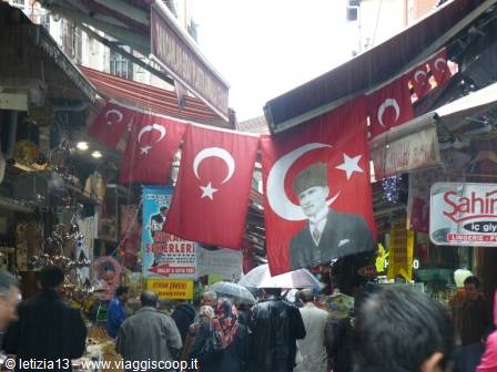Turkish flags with Mustafa Kemal Atatürk hanging above Istanbul's crowded bazaar